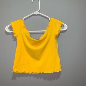 a yellow off the shoulder crop top
